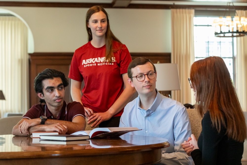 Honors students presenting their research to alumni Corbin Stinnett who served as a guest lecturer in the Honors Arkansas course "Health and Wellness."