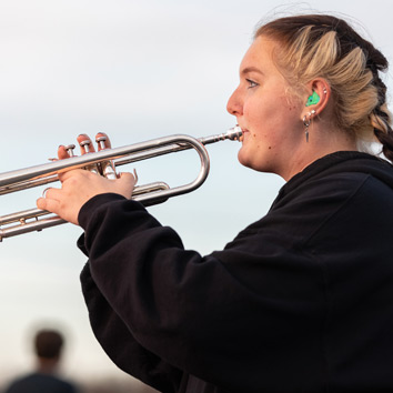 Student Playing a Trumpet