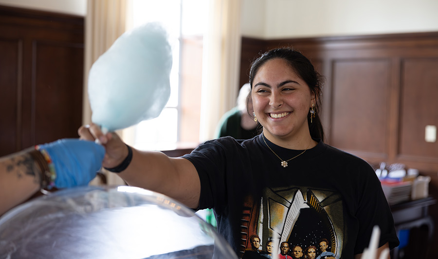 Student handing out cotton candy